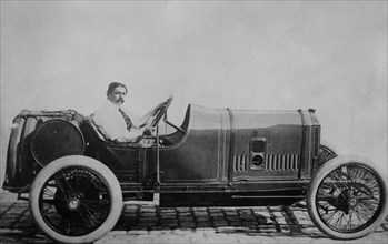 Georges Louis Frederic Boillot (1884-1916), a French Grand Prix motor racing driver sitting in a Peugot EX3, possibly ca. June 1914 when he set a new speed record at the Indianapolis 500