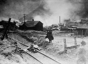 Colorado Coalfield Miners Strike of 1913-1914 - Forbes, Colo. -- Comrade, after battle, rescuing body of slain miner