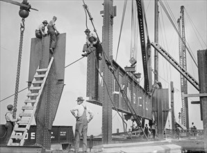 Putting 46 ton girder in place Consolidated Gas Company building, 15th and Irving, New York City ca. 1913