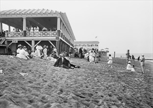 People enjoying a day on the beach in Asbury Park, NJ ca. 1910-1915