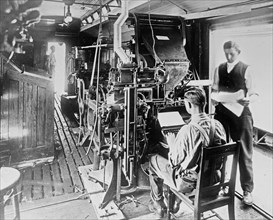 Linotype on press car on the Great Northern Railway ca. July 1913