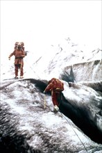 Men climbing the snout of Exit Glacier, Alaska ca. 1975