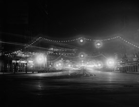 Night view of Pennsylvania Avenue in Washington, D.C., decorated with electric lights for the first inauguration of President Woodrow Wilson ca. March 3, 1913