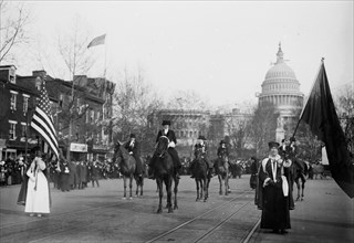 Grand Marshal Mrs. Richard Coke Burleson (center, on horseback) leading suffrage march on March 3, 1913