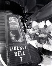 Assisted by Astronaut John Glenn, Astronaut Virgil Grissom enters the Mercury capsule, Liberty Bell 7, for the MR-4 mission on July 21, 1961.