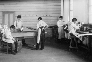 Students at United States Indian School, working in the tin shop, Carlisle, PA ca. 1910-1915