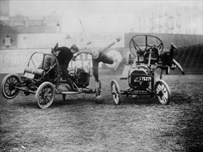 Photo shows a staged scene from a real sport called auto polo, at Hilltop Park, New York ca. 1910-1915