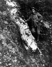 In this photo, taken on Sept 11, 1911, we see a prospector standing next to a gold-bearing quartz vein on the property of the Seward Bonanza Gold Mines Co.,
