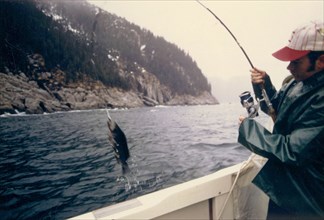 5/16/1973 - Man fishing in Aialik Bay, Alaska