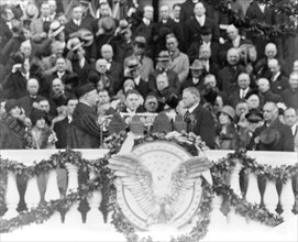Chief Justice William H. Taft administering the oath of office to Herbert Hoover on the east portico of the U.S. Capitol, March 4, 1929