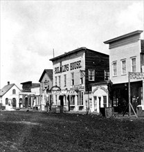 This is a stereoscopic view of Main St in Cheyenne (Laramie County), Wyoming in 1869.