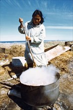 July 1974 - Eskimo woman boiling walrus flippers
