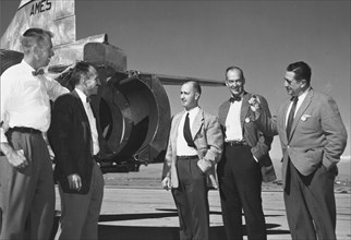Seth B. ANDERSON AND NACA AMES PILOT Gorge E. COOPER WITH W.E. RHOADES, ROBERT McIVER, MICHAEL CASSENLY OF UNITED AIRLINES. Visit Ames to dicuss Thrust Reverser Problems. ca. 1957
