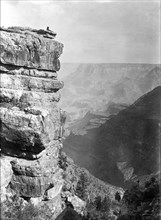 Ca. early 1900s - Man relaxing on edge of Grand Canyon