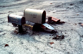 This photo was taken on July 15, 1980 which shows the after-effects of the Mount St. Helens eruption. Here we see mudflow almost to the top of the mailbox posts near Cowlitz River in Cowlitz County, W...
