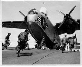 A Martin PBM Mariner's crew scrambles in response to a SAR call. The late-1940s and early 1950s were the heyday of large seaplanes.