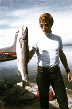 8/21/1972 - Man holding trout at Naknek Lake, Katmai National Monument, Alaska