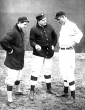 Rube Marquard standing at right, (Libe?) Washburn in center & Mike Donlin standing at left, New York, NL (baseball) ca. 1911