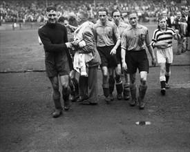 September 21, 1947 - Soccer players leaving the field after a match