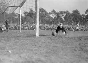 1940s Men's Soccer Match - AGOVV goalie is lucky with ball against post on October 10, 1947