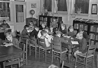 1940s Libraries - Young boys in the children's reading room Wijdesteeg in Amsterdam ca. October 1947