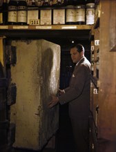 1948 - man entering a wine cellar at a night club in new york city