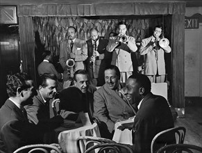 Portrait of Ben Webster, Eddie (Emmanuel) Barefield, Buck Clayton, Benny Morton, Joe Marsala, and Cozy Cole, Famous Door, New York, N.Y., ca. Oct. 1947