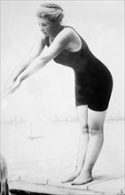 Photo shows Rose Pitonof, champion long distance swimmer, wearing a bathing suit. ca. 1910-1915