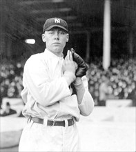 Ray Keating, New York Yankees pitcher, facing front, standing, holding a ball in his glove 4 18 1913