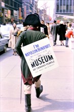 1966 - Man dressed up as Napoleon Bonaparte advertising the Museum of Famous People while walking down a street in New York City