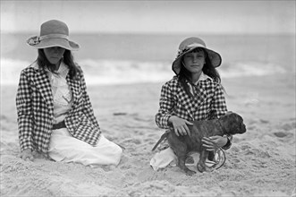 Jean and Charlotte Potter (young girls on a beach with a dog) ca. 1910-1915