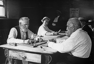 Old men playing cribbage -- Sailors' Snug Harbor ca. 1910-1915