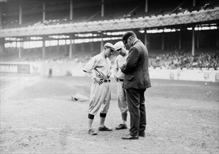 Managers John McGraw, New York NL, and Miller Huggins, St. Louis NL, with umpire William T. 'Bill' Brennan ca. 1913
