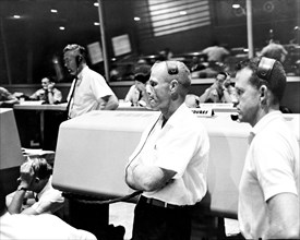 (21 July 1961) View of the Mission Control Center at Cape Canaveral during the Mercury-Redstone 4 (MR-4) mission. Astronauts John Glenn (left) and L. Gordon Cooper (right) act as spacecraft communicat...