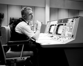 (April 1965) Prior to the Gemini-Titan 4 mission, flight director Eugene F. Kranz is pictured during a simulation at the Flight Director console in Houston's Mission Control Center on the Manned Space...