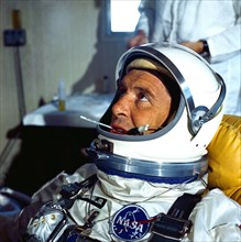(8 March 1965) Astronaut Walter M. Schirra Jr., the command pilot of the GT-3 backup crew, is shown suited up for prelaunch tests. He is shown with his helmet visor up and a thermometer in his mouth.