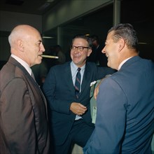 (15 Sept. 1966) Dr. Robert R. Gilruth (left) smokes a cigar in Houston's Mission Control Center to celebrate the successful splashdown of Gemini-11.