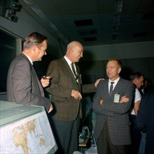 (15 Nov. 1966) Dr. Robert R. Gilruth (center) talks to other NASA officials in Mission Control Center near the end of the Gemini-12 mission.