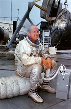 (23 July 1966) Astronaut Charles Conrad Jr., prime crew command pilot of the Gemini-11 spaceflight, relaxes on deck of the NASA Motor Vessel Retriever after suiting up for water egress training in the...