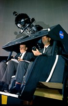 (7 May 1965) Astronauts James A. McDivitt (right) and Edward H. White II are shown at the Morehead Planetarium in North Carolina, checking out celestial navigation equipment as part of their training ...