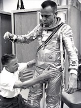 Astronaut Alan Shepard fitted with space suit prior to the first manned suborbital flight. Freedom 7, carrying Astronaut Alan Shepard, boosted by the Mercury-Redstone launch vehicle, lifted off on May...