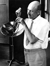 Dr. Robert Goddard with his apparatus for solar energy study at Clark University, Worcester, Mass. (1932-1934).