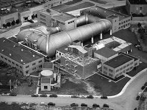 This aerial photograph shows the entire original wind tunnel complex at the National Advisory Committee for Aeronautics (NACA) Aircraft Engine Research Laboratory. September 1945
