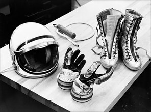 (28 July 1961) Table top view of some of the Mercury suit components including gloves, boots and helmet.