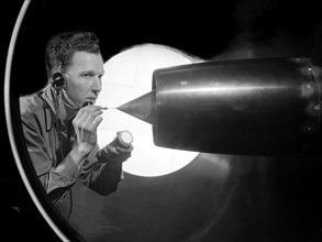 NACA Technician Cleans a Ramjet in 8- by 6-Foot Supersonic Wind Tunnel ca. 1950