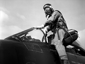 Pilot Joseph Algranti entering a McDonnell F2H-2B Banshee ca. 1958