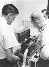 (1961) Astronaut John H. Glenn Jr. having an electrocardiograph done by Dr. Jackson during medical testing at the Pensacola Naval Station.