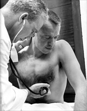 1961 - Astronaut Alan B. Shepard has his blood pressure and temperature checked