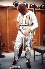 (20 Feb. 1962) Astronaut John H. Glenn Jr. dons spacesuit during preflight operations at Cape Canaveral, Feb. 20, 1962, the day he flew his Mercury-Atlas 6 spacecraft, Friendship 7, into orbital fligh...