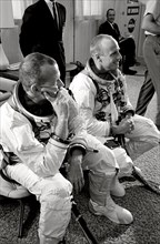 (19 Aug. 1965) Astronauts Charles Conrad Jr. (right) and L. Gordon Cooper Jr. are pictured during suiting up operations before Gemini-5 spaceflight.